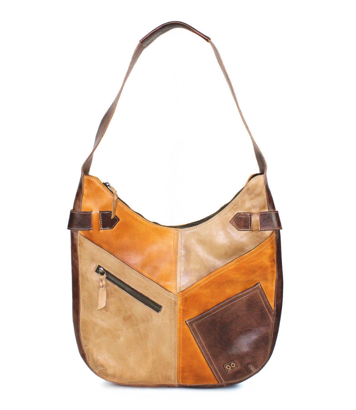 The Argus by Bed Stu is a handcrafted leather shoulder bag with a single strap, featuring patchwork in brown and tan, oversized front pockets, and visible stitching.
