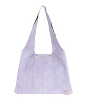 The Ariel II by Bed Stu is a light lavender shoulder bag with two long straps and a label near the top, offering a minimalist tote style. It has a spacious main compartment, ideal for carrying essentials in its lightweight design.