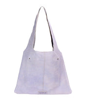 The Ariel II by Bed Stu is a light gray shoulder bag with a wide strap, front pocket, and logo patch at the bottom center. Designed for everyday use, it features a spacious main compartment in a lightweight design.