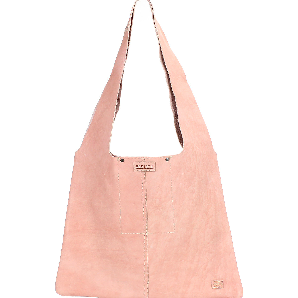 The Ariel II by Bed Stu is a pink suede tote bag with a wide single strap and visible stitching. Its minimalist charm is enhanced by a spacious main compartment, while subtle branding is achieved through an embossed small logo at the bottom right corner.