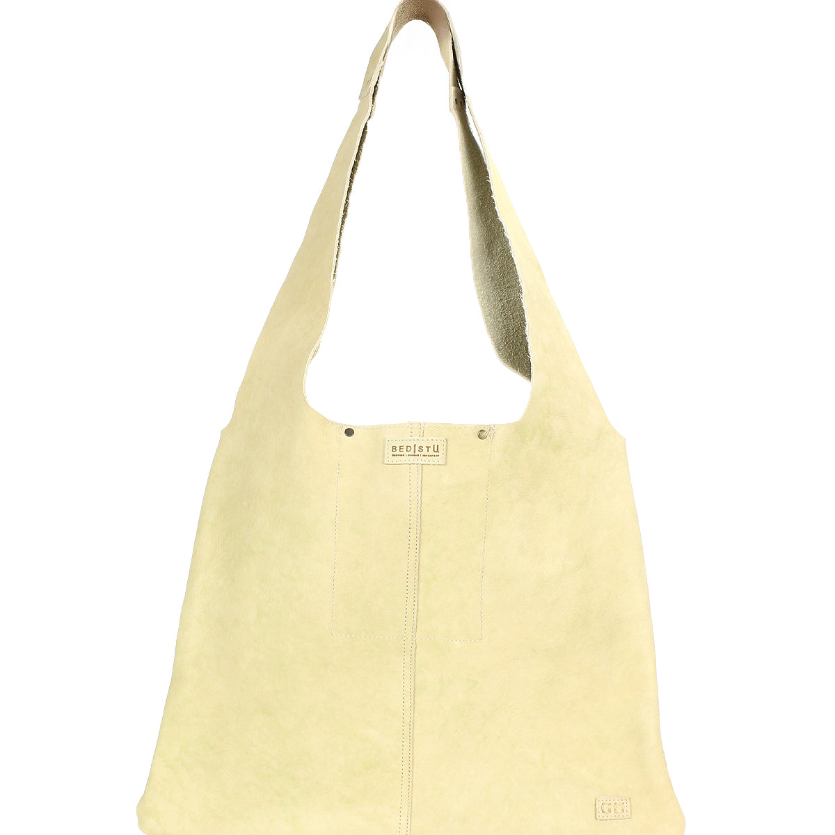 The Ariel II by Bed Stu is a beige suede shoulder bag with a wide strap, subtle stitching, and a small logo near the bottom, combining minimalism and functionality.