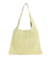 The Ariel II by Bed Stu is a lightweight beige shoulder bag with a wide strap and a visible logo tag. This minimalist tote offers a simple aesthetic, perfect for any occasion.