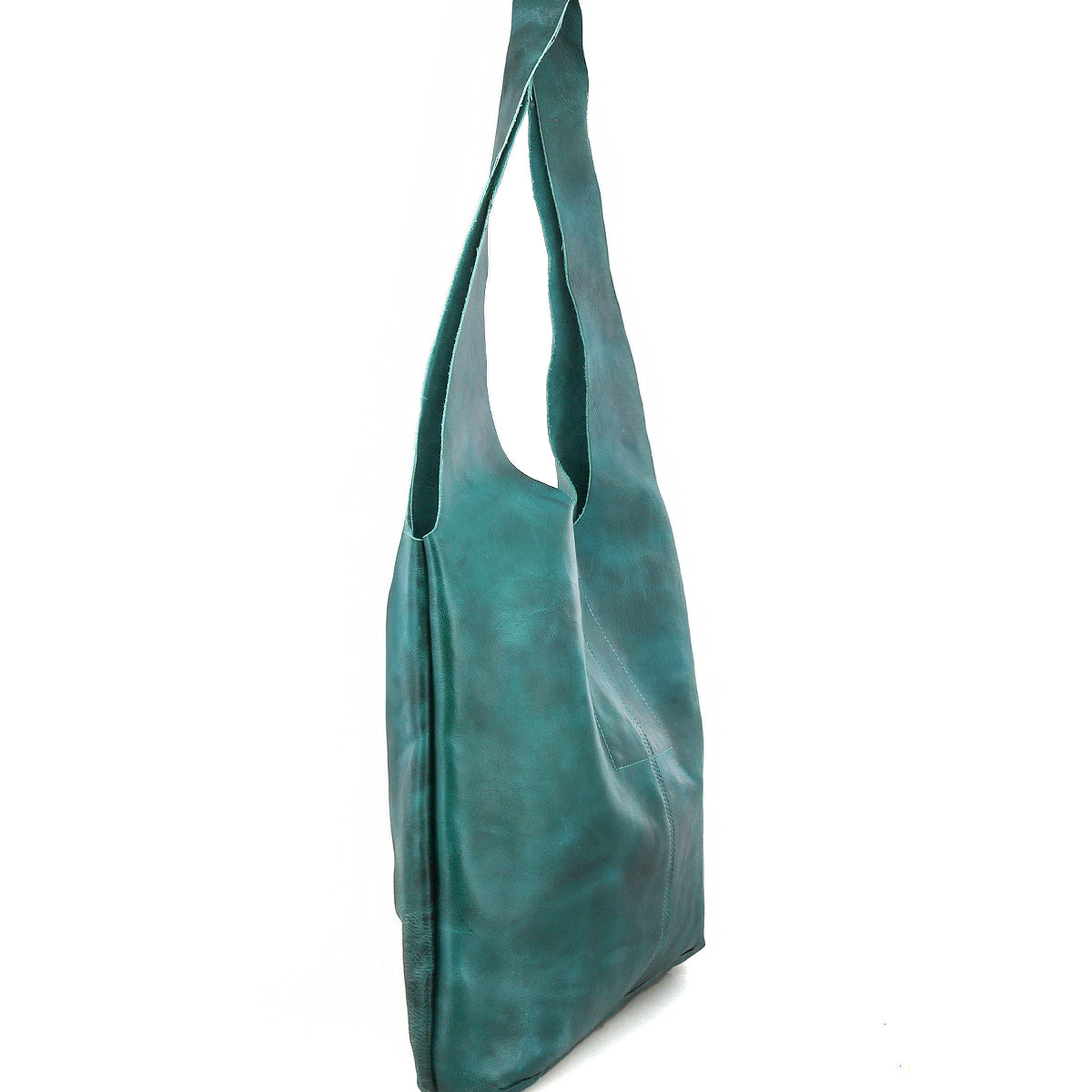The Ariel Max by Bed Stu is a teal, slouchy oversized tote bag in hand-finished leather with a single wide strap, shown upright against a white background.