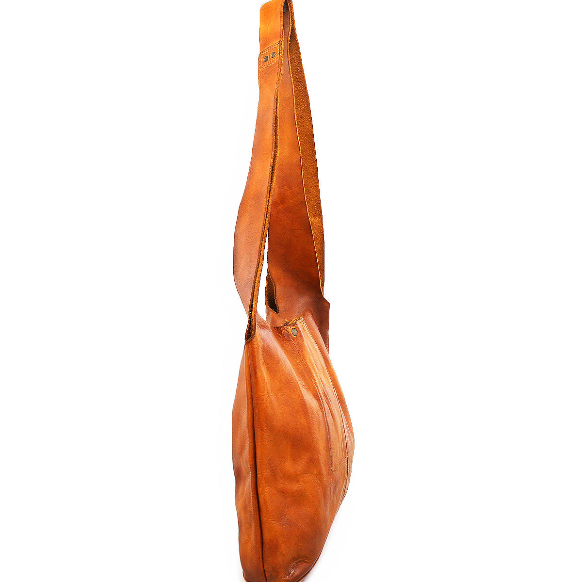 The Bed Stu Ariel Mid is a brown artisanal leather bag with a long, wide strap and magnetic closure, shown from the side on a white background—perfect for everyday function.