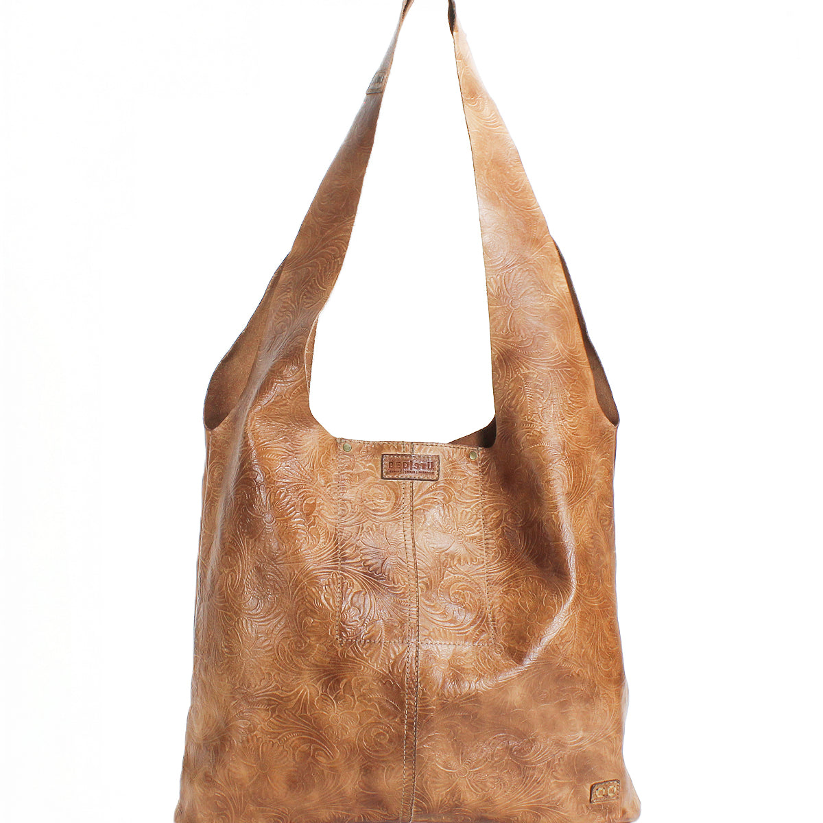 The Bed Stu Ariel EM is a large, tan leather minimalist bag featuring a wide strap and embossed swirl pattern, shown upright against a white background.