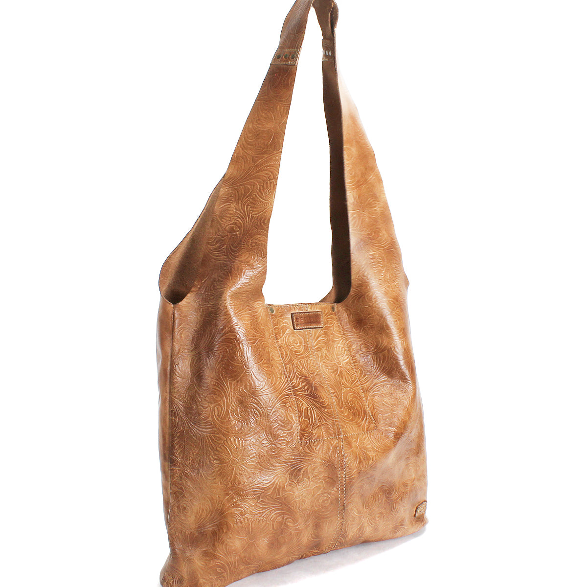 The Ariel EM by Bed Stu is a light brown leather minimalist tote featuring a subtle embossed floral pattern, wide strap, and rectangular metal logo plate on the front—perfect for everyday use.