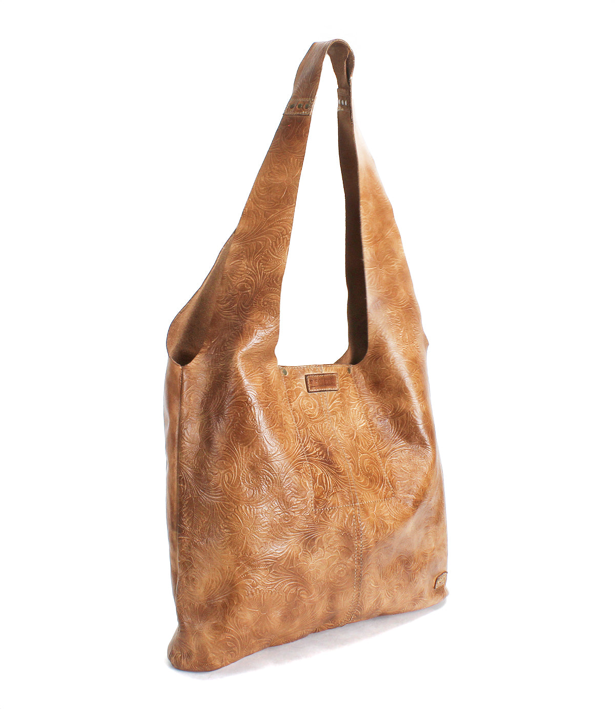 The Ariel EM by Bed Stu is a light brown leather minimalist tote featuring a subtle embossed floral pattern, wide strap, and rectangular metal logo plate on the front—perfect for everyday use.