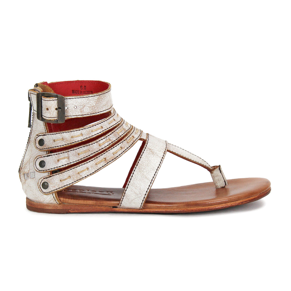 The Bed Stu Artemis II is a flat, open-toe gladiator sandal with metallic leather straps, an ankle buckle, side zipper, and wooden sole, shown in a side view.