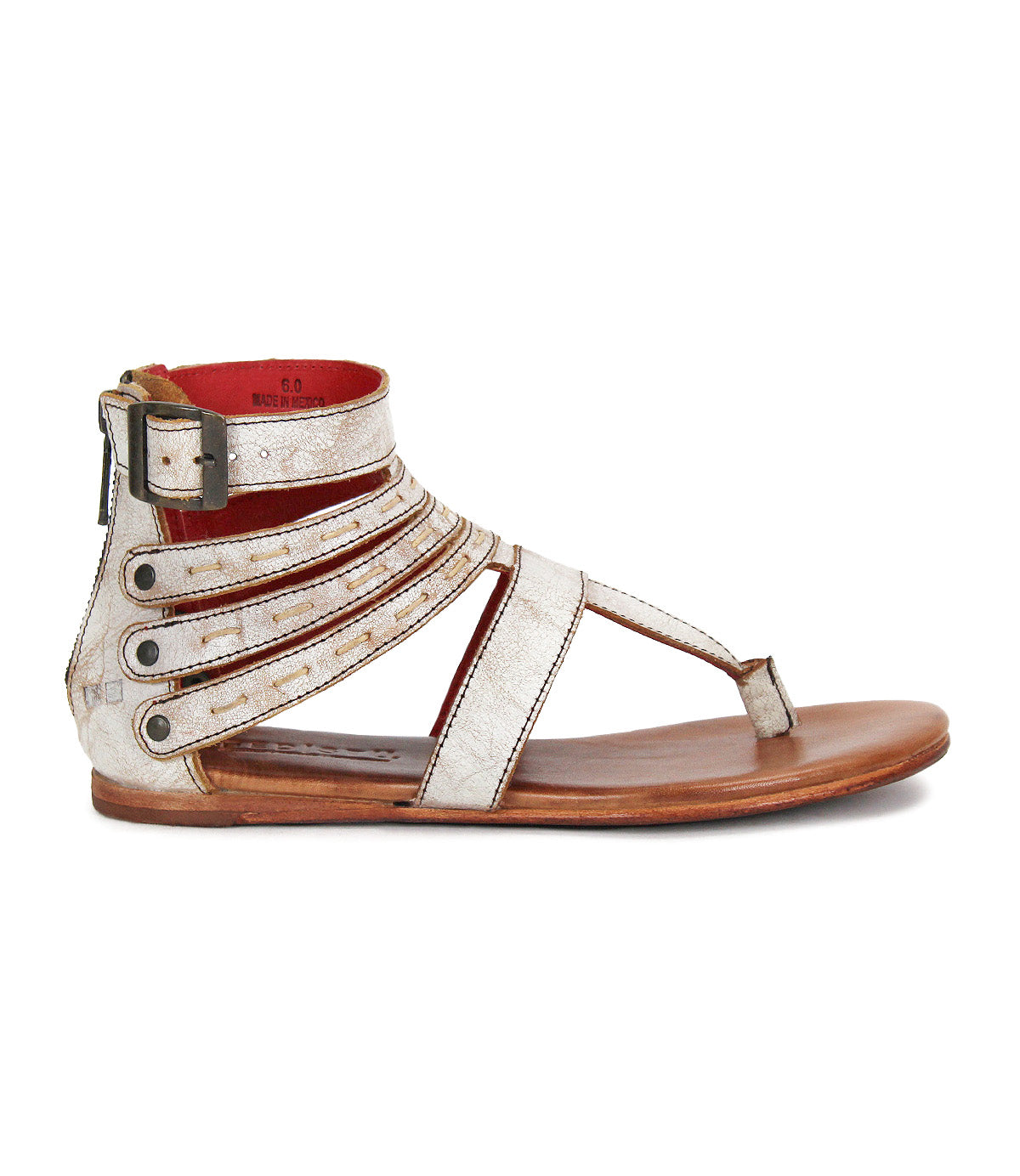 The Bed Stu Artemis II is a flat, open-toe gladiator sandal with metallic leather straps, an ankle buckle, side zipper, and wooden sole, shown in a side view.
