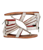 The Bed Stu Artemis II is a pair of flat gladiator sandals featuring strappy open-toe leather straps, metal rivets, and buckles, shown in a side profile view.