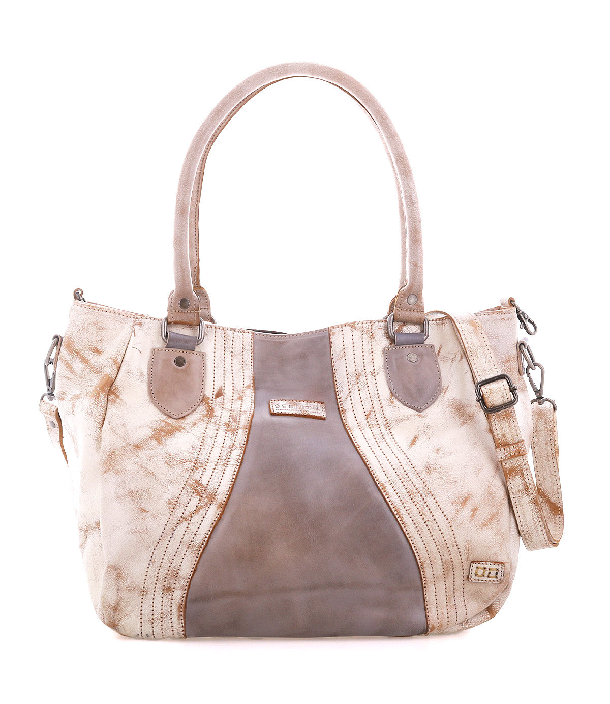 The Bed Stu Astana is a modern handbag in beige and taupe leather with double handles, decorative stitching, metal hardware accents, and a detachable shoulder strap—ideal for everyday use.