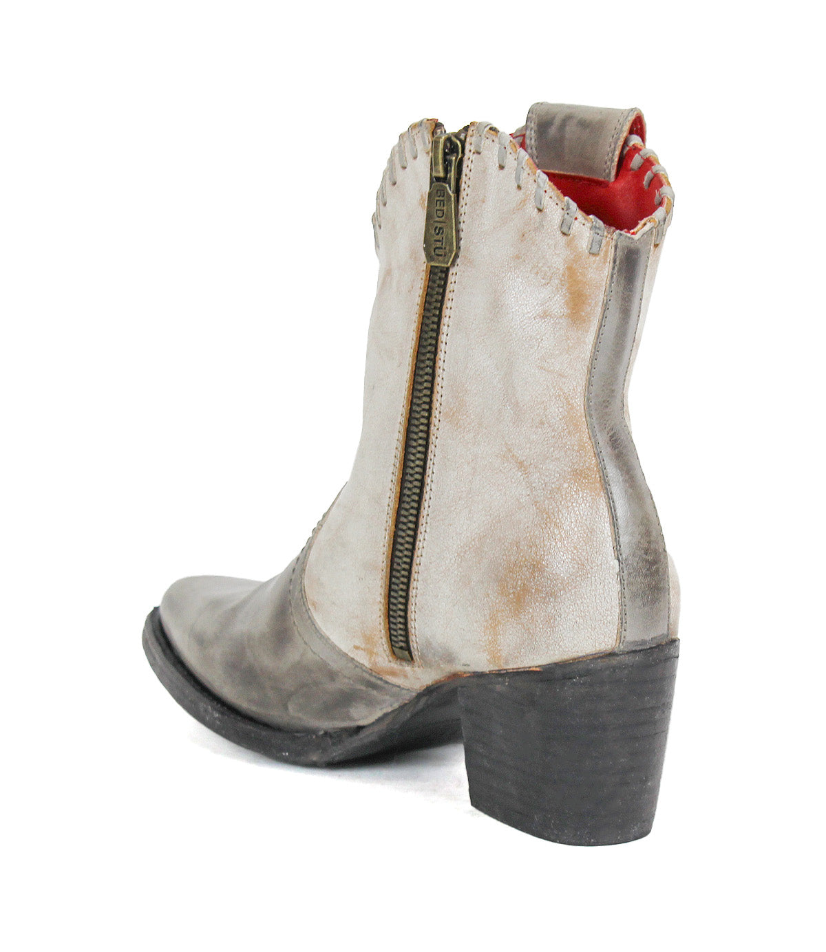 The Baila II by Bed Stu is a gray and white leather ankle boot with artisanal construction, a side zipper, black chunky heel, and red inner lining, shown from the back and side.