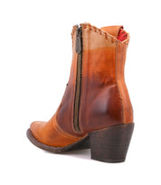 Bed|Stü Baila II western-inspired tan and brown leather ankle boot with a pointed toe, side zipper, and stacked heel.