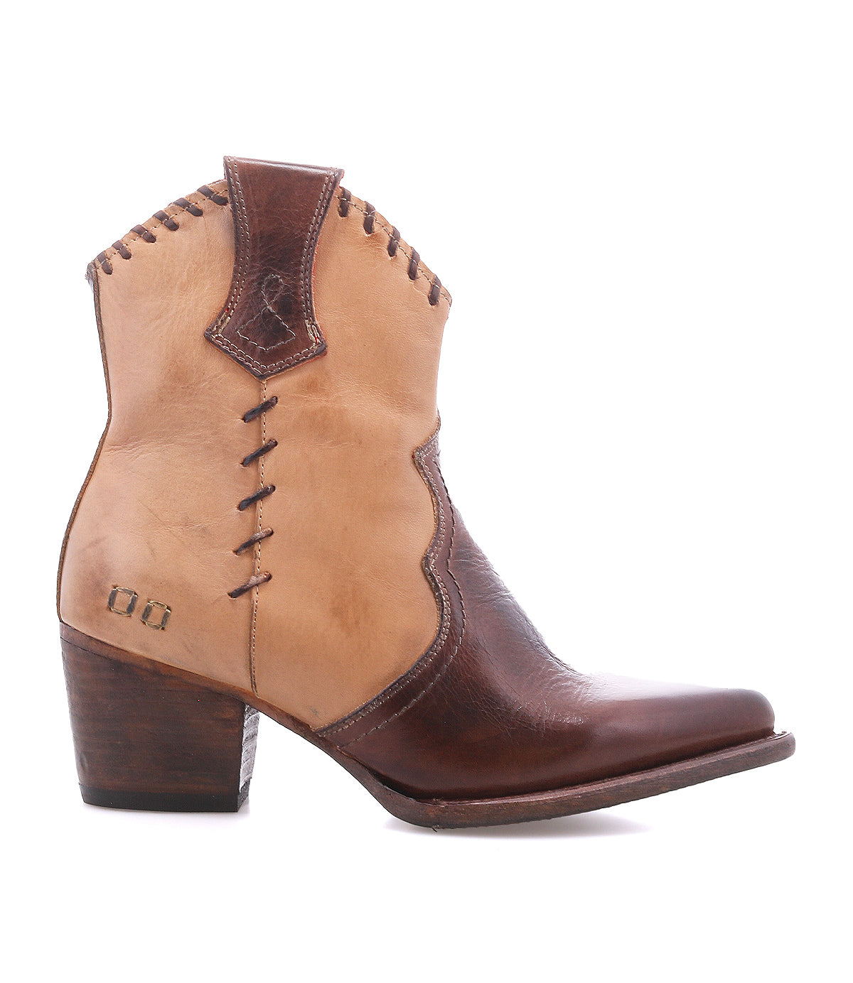 The Baila II by Bed|Stü is a two-tone brown leather cowboy boot with artisanal construction, featuring decorative stitching, a wooden heel, and a pointed toe. This Western-inspired boot is shown in a side view against a white background.
