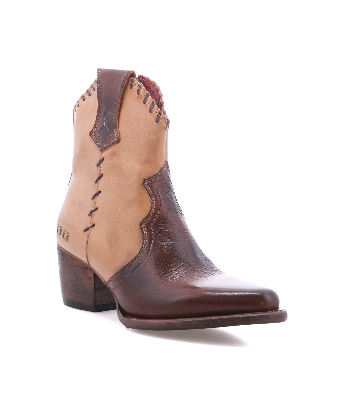 The Baila II by Bed|Stü is a brown and tan leather ankle cowboy boot featuring decorative stitching, a low stacked heel, and a pointed toe. Artisanal construction highlights its classic Western-inspired style, as photographed against a white background.