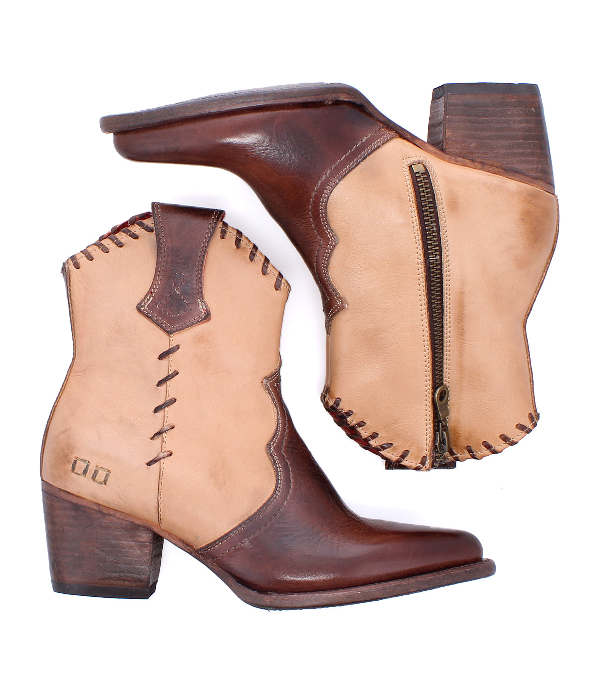 Baila II by Bed|Stü is a pair of two-tone leather cowboy boots displayed on a white background, featuring a pointed toe, brown heels, decorative stitching, side zipper, and scalloped edging. These Western-inspired boots exemplify artisanal construction for lasting style and durability.