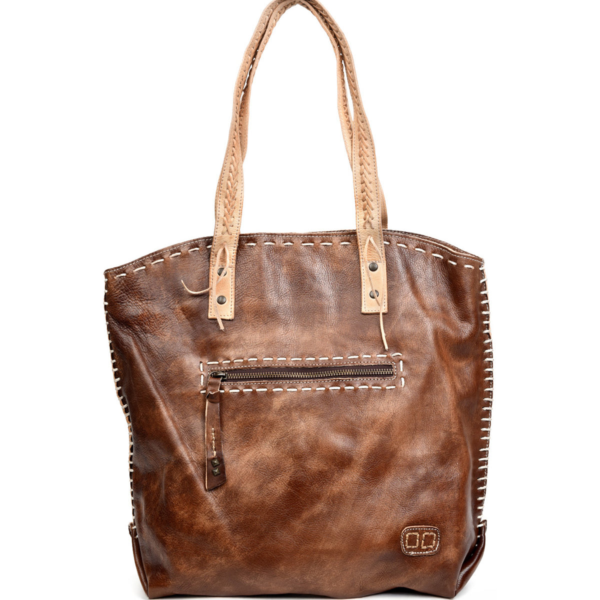 The Bed Stu Barra is a brown leather tote with tan handles, front zipper pocket, contrast stitching, and a small embossed logo at the lower right. Handmade with eco-friendly finishes for timeless, sustainable style.