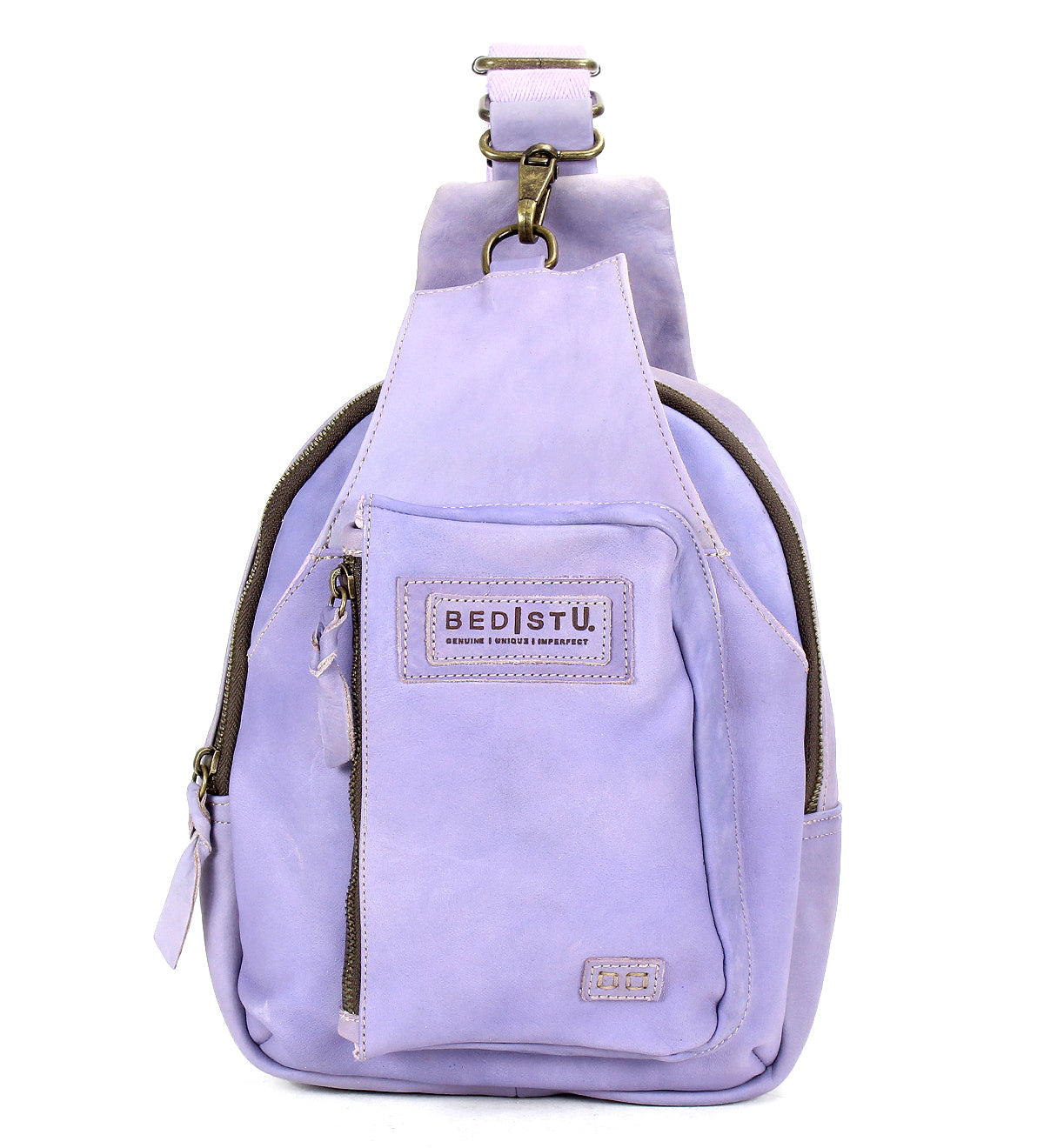 Introducing the Beau by Bed|Stü: a small, light purple leather sling bag featuring a front zipper pocket and a signature Bed|Stü logo patch on the front. This compact backpack is perfect for carrying your essentials in style.