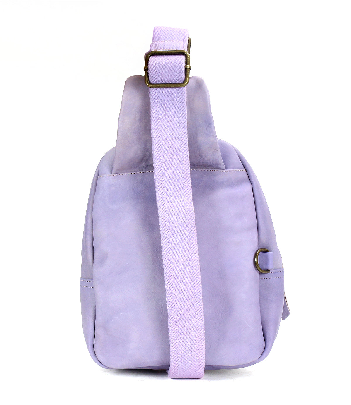 The Bed Stu Beau is a light purple leather sling backpack with a wide, durable strap, shown from the back against a white background—ideal for hands-free activities.