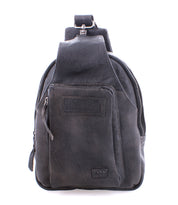 Black leather Beau sling backpack by Bed Stu isolated on a white background, perfect for hands-free activities.