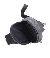 An open, empty gray leather Beau sling backpack with a zipper on a white background by Bed Stu.