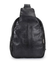 The Bed Stu Beau is a black leather sling backpack with a front pocket and single wide strap, shown upright against a white background.