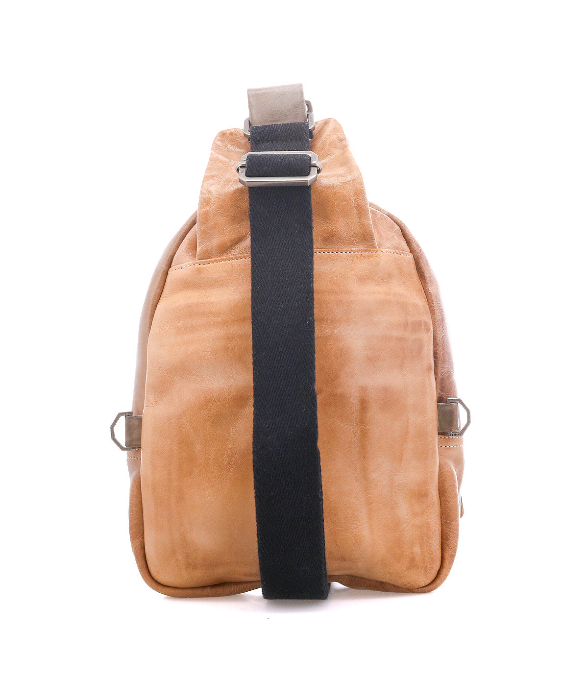 The Beau by Bed Stu is a tan leather sling backpack with a black adjustable strap, shown from the back on a white background. This hands-free bag offers style and convenience for everyday use.