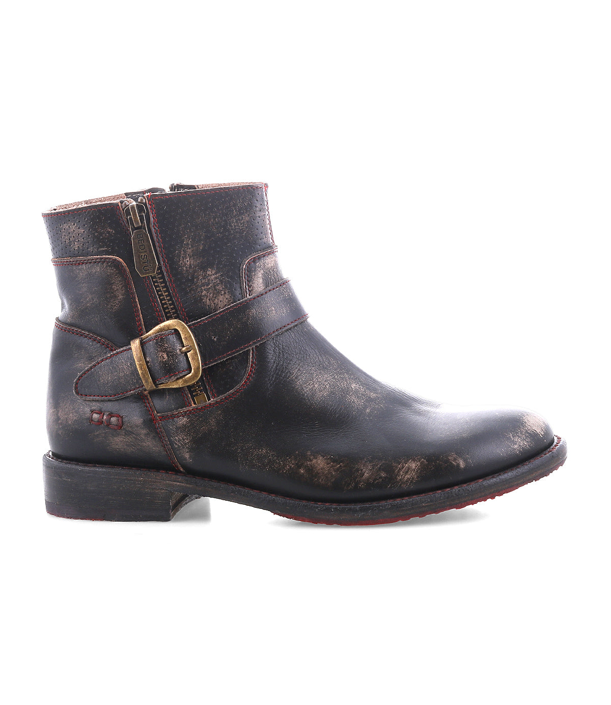 The Becca by Bed Stu is a distressed brown leather short engineer boot with dual zippers, an ankle buckle strap detail, and a low heel.