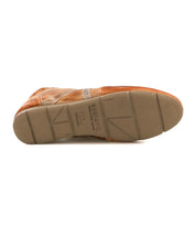 The Bed Stu Bingo II brown leather sneaker is shown with its sole facing up, highlighting the tread patterns and imprinted text on its XL EXTRALIGHT outsole.