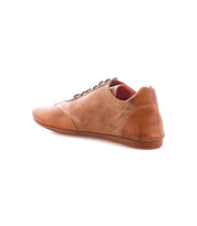 The Bed Stu Bingo II is a brown leather lace-up sneaker with Goodyear construction and an EXTRALIGHT outsole, shown from the rear side angle on a white background.