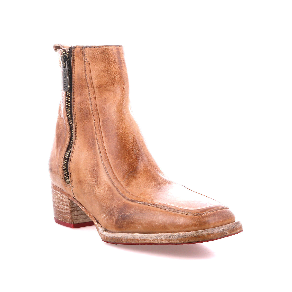 The Bed Stu Bitsy is a tan leather ankle boot with a side zipper, stacked wooden heel, and lightly worn sole, shown against a white background.