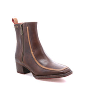 The Bed Stu Bitsy is a brown leather ankle boot featuring a stacked heel, side zipper, tan trim, and back pull tab, shown on a white background.