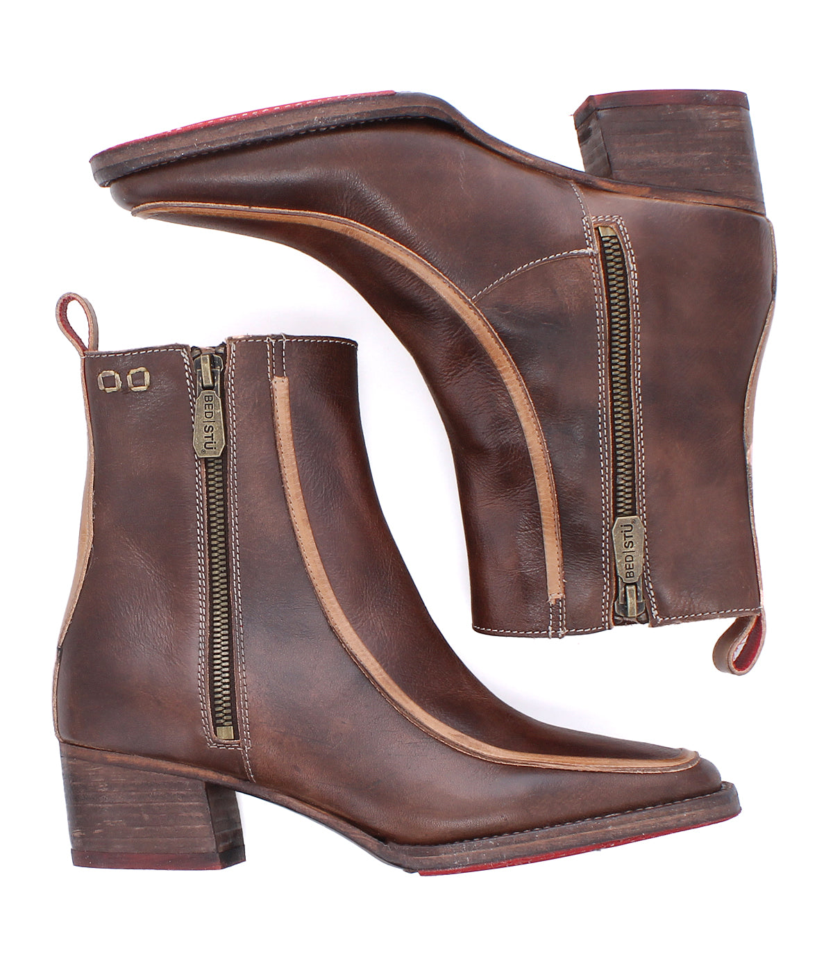 The Bed Stu Bitsy is a pair of brown leather ankle boots with side zippers, stacked heels, pull tabs, and square toes. Shown from the side and sole view, these boots combine style and comfort for any occasion.