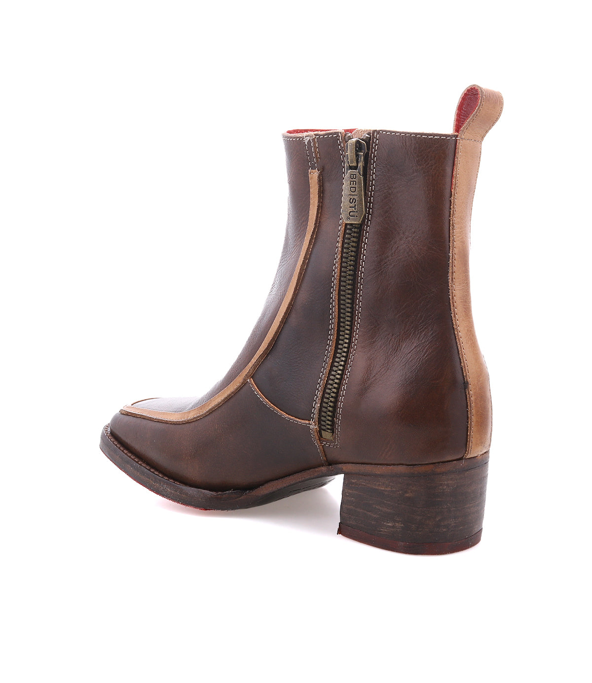 The Bed Stu Bitsy is a brown leather ankle boot featuring a side zipper, low stacked heel, and contrasting tan trim—an elegant twist on classic square toe boots.