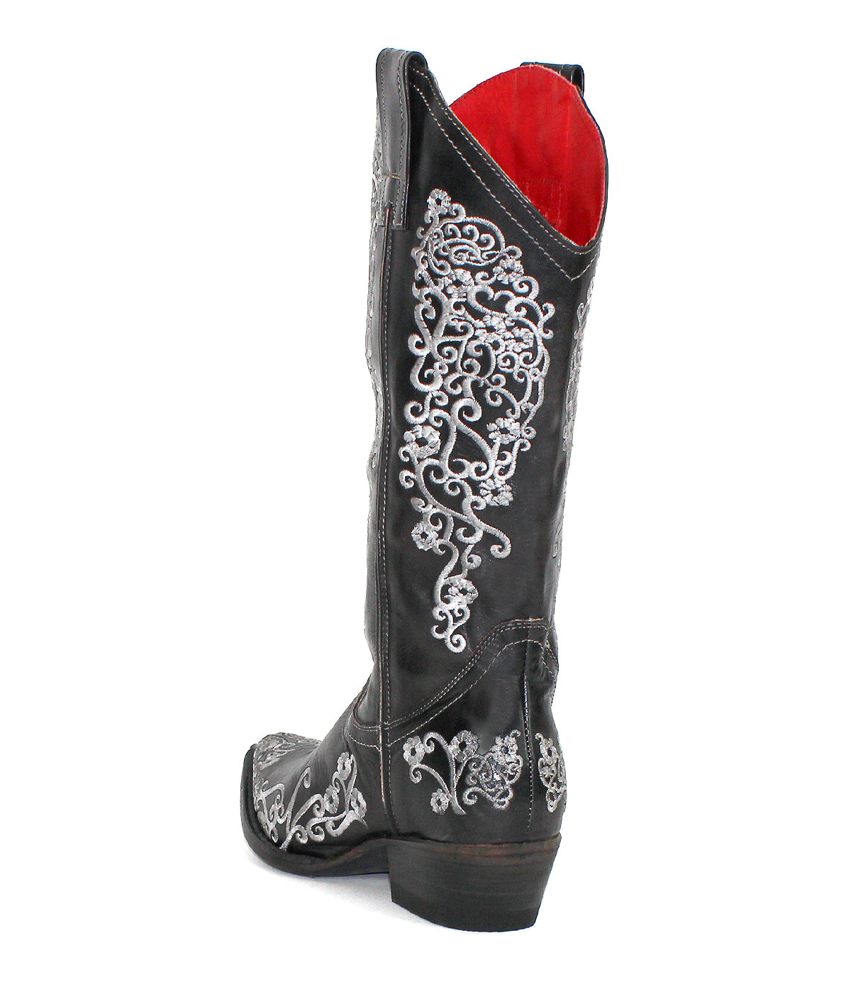The Bed Stu Blackjack is a black leather Western tall boot with silver floral embroidery, a red interior lining, and a snip toe, shown from the side and slightly behind.