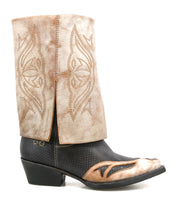 The Bed Stu Blind is a handcrafted leather Western boot with a light tan decorative upper, black textured lower, angled heel, and stitched patterns—perfectly blending classic style with detailed artistry.