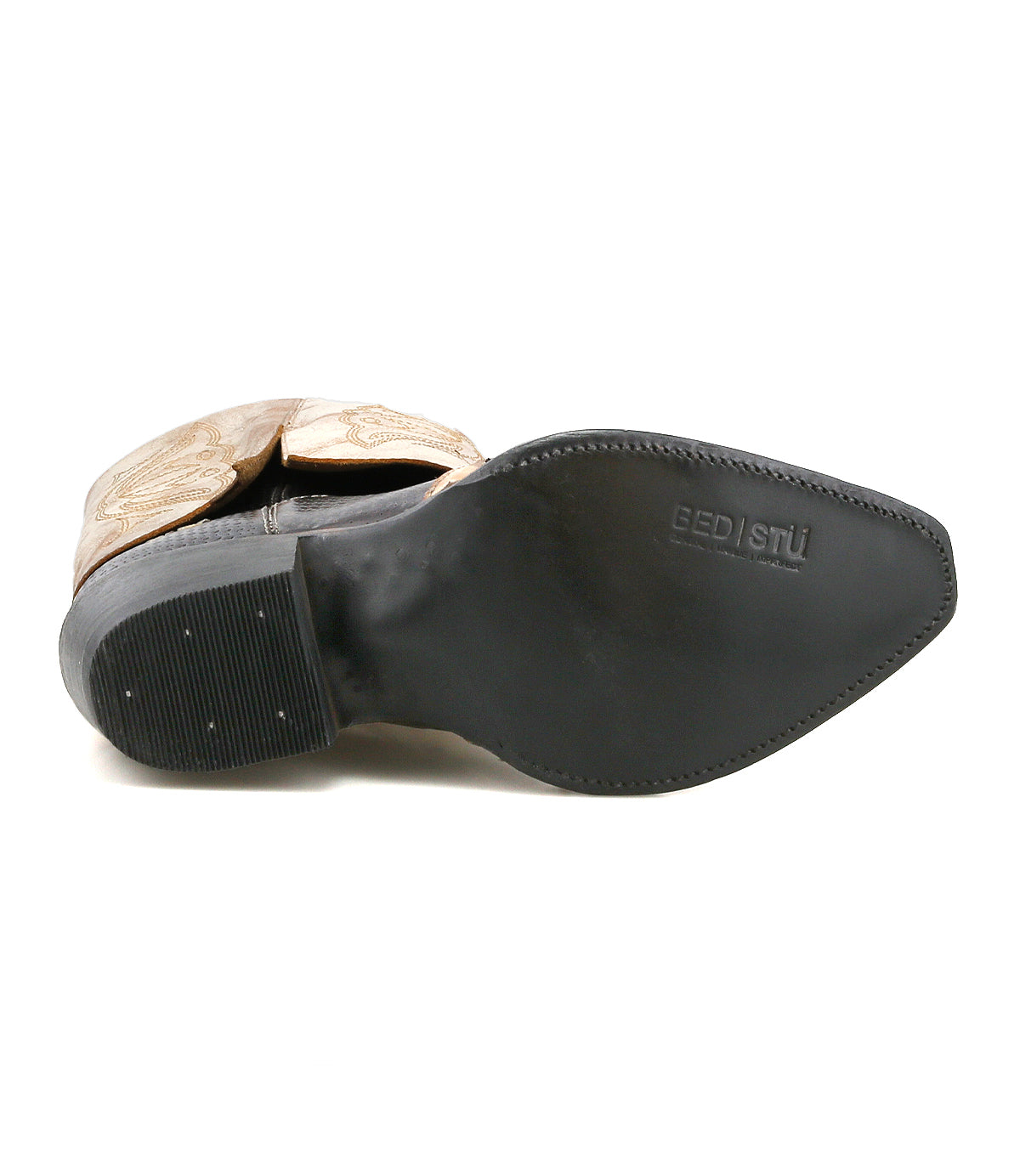 Bottom view of a single tan handcrafted leather Blind Western boot by Bed Stu, featuring a black sole with the "Bed Stu" logo embossed near the heel.