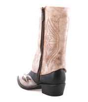 The Bed Stu Blind boot features a tan and black Western silhouette with a decorative pattern, visible side zipper, and low heel, crafted in distressed leather and shown against a white background.