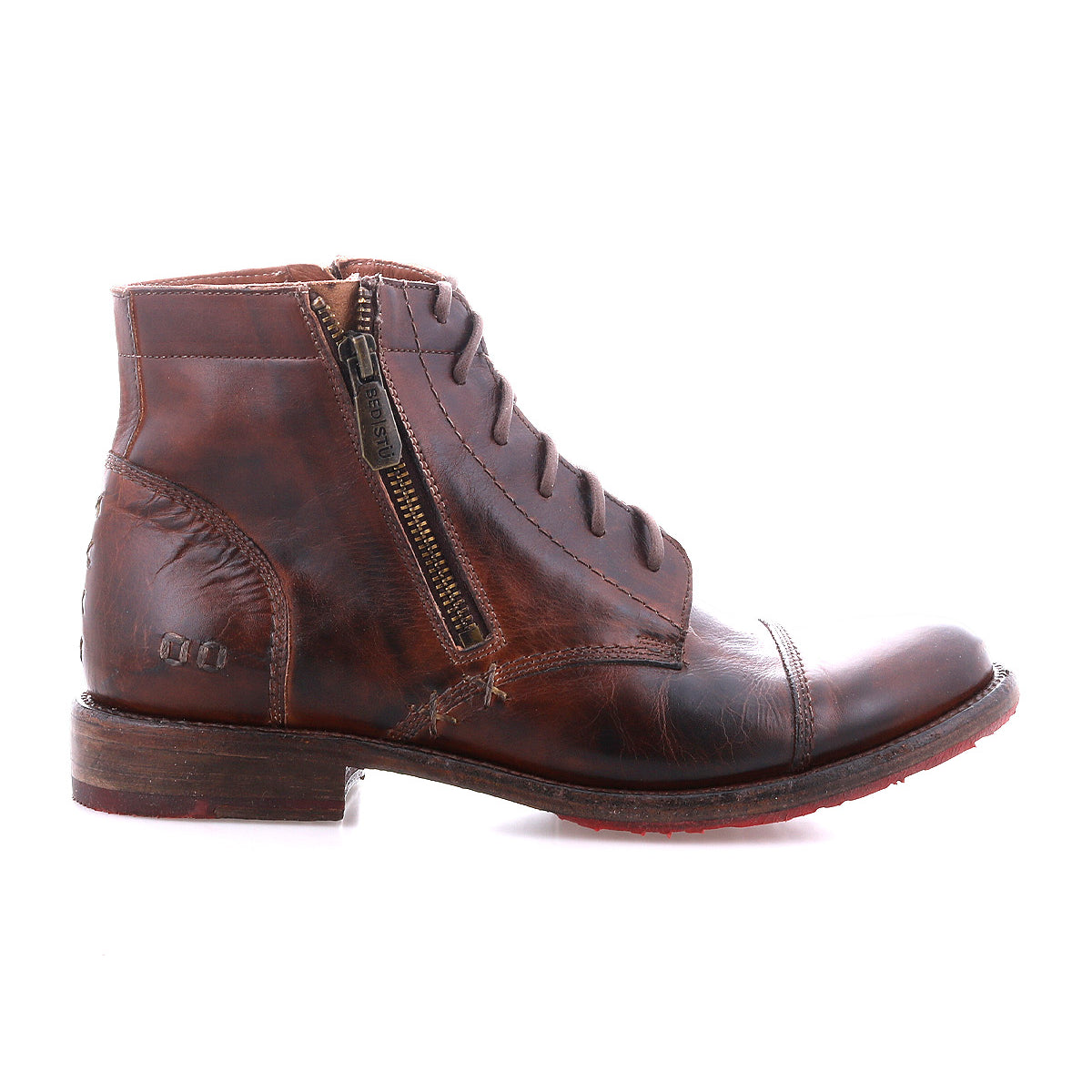 The Bed Stu Bonnie II is a brown leather combat ankle boot with a cap toe, visible stitching, side zipper, laces, and low heel, displayed against a white background.
