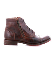 The Bed Stu Bonnie II is a brown leather combat ankle boot with a cap toe, visible stitching, side zipper, laces, and low heel, displayed against a white background.
