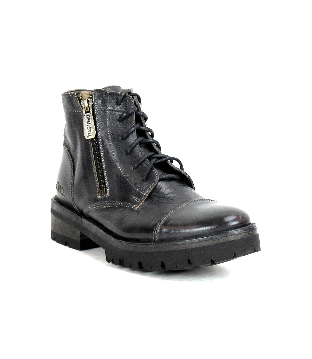 The Bed|Stü Bonnie IV is a black leather combat boot, featuring a secure fit, lace-up design, rugged sole, and convenient side zipper, shown on a white background.
