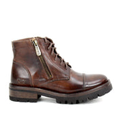 Bed|Stü’s Bonnie IV is a brown leather lace-up ankle combat boot, designed with dual side zippers for a secure fit, a low stacked heel, and a thick textured sole, displayed in a left side profile view.