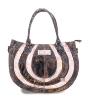 The Bed Stu Brawler is a large, worn leather tote bag with a circular brown and white pattern. It features double handles, a small stitched external pocket, and ample space for all your essentials.
