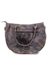 The Bed Stu Brawler is a worn brown leather carryall tote with handles, a front zipper pocket, and a slightly distressed texture, featuring an optional crossbody strap for versatile wear.