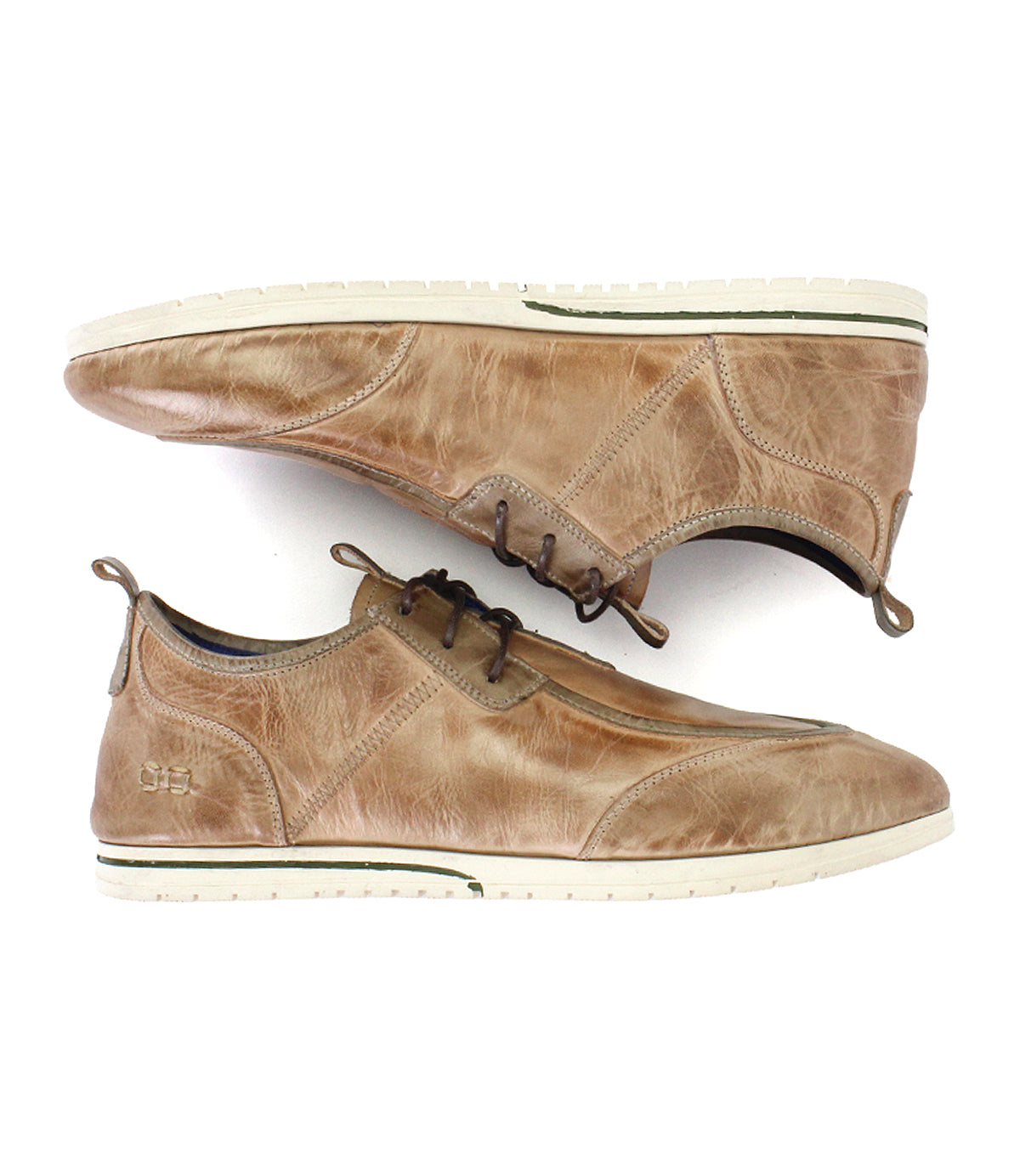 A pair of Bed|Stü Britches chukka-style casual shoes in refined brown leather with white soles, displayed side by side—one upright and the other lying on its side.