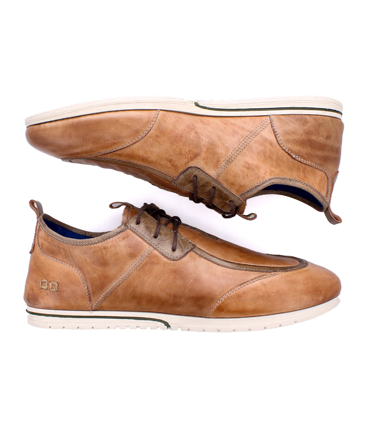 A pair of Bed|Stü Britches brown leather chukka-style casual shoes with white soles, displayed side by side—one upright and one on its side—set against a white background.