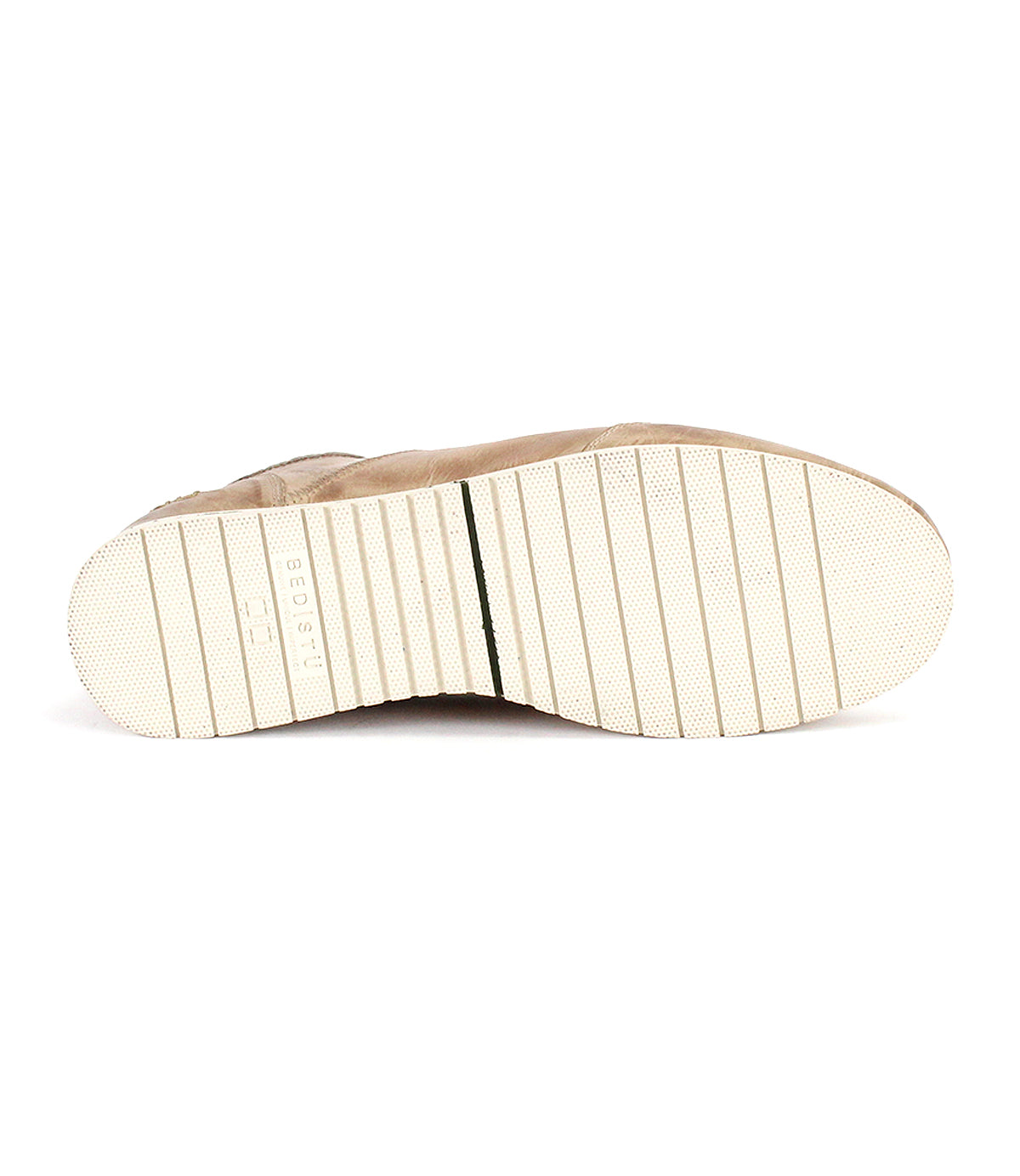 Bed|Stü's Britches chukka-style shoe in beige, viewed from the bottom to display its white rubber sole with horizontal grooves and a subtle embossed logo—offering the perfect blend of classic leather sneaker sophistication.