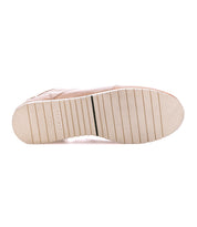 The Britches shoe from Bed|Stü features a beige sole with textured horizontal grooves and a distinctive black line near the center, seen from the bottom—a refined finishing touch ideal for chukka-style leather sneakers.