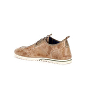 The Bed|Stü Britches is a refined brown chukka-style leather sneaker with a white sole, shown from the rear left side against a white background.