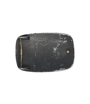 Rectangular, worn black Bed Stu 95 Buckle with visible scratches, a single screw, and "BEDSTU Buckles...gotta have 'em" engraved on its rugged metal surface.